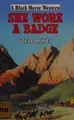 Cover image for She wore a badge