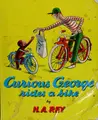 Cover image for Curious George rides a bike
