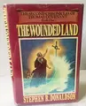 Cover image for The wounded land