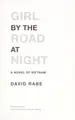 Cover image for Girl by the road at night